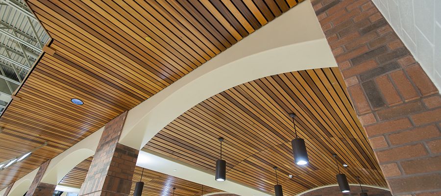 How a Wood-Slatted Ceiling Enhances the Ambiance of Your Commercial Space –  Rulon International